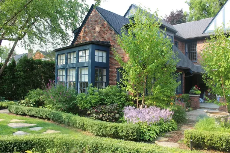 Outdoor garden with trees, shrubs, and flowers