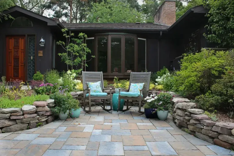 Outdoor walkway with rocking chairs and flowers